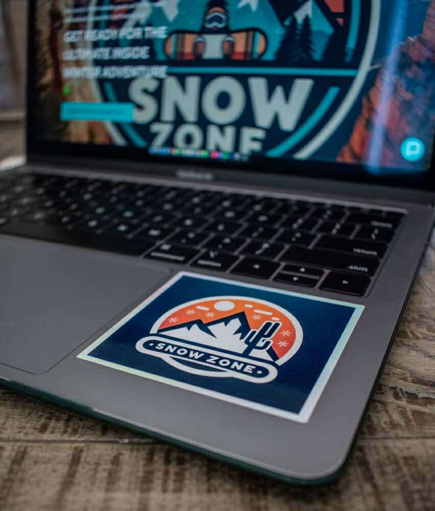 Water and UV proof Snow Zone sticker on laptop corner